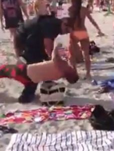 Cop Tackles Unruly Beachgoer, from video by Darrell Tate